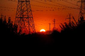 High Voltage Pylons During Sunset Time