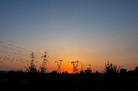 High Voltage Pylons During Sunset Time