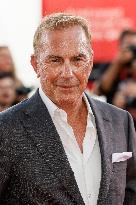 81st Mostra - Sienna Miller And Kevin Costner Walk The Red Carpet