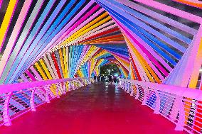 Rainbow Bridge and Ferris Wheel Night View in Qingdao