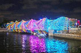 Rainbow Bridge and Ferris Wheel Night View in Qingdao