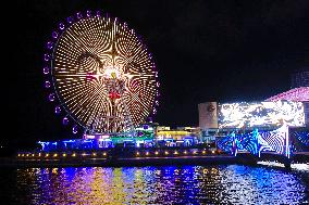 Rainbow Bridge and Ferris Wheel Night View in Qingdao