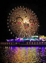 Rainbow Bridge and Ferris Wheel Night View in Qingdao