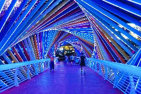 Rainbow Bridge and Ferris Wheel Night View in Qingdao