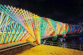 Rainbow Bridge and Ferris Wheel Night View in Qingdao