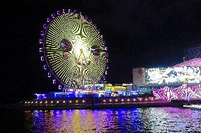 Rainbow Bridge and Ferris Wheel Night View in Qingdao