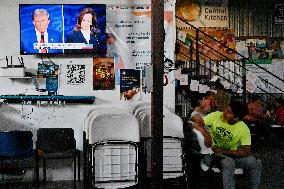 2024 US Presidential Election: Migrants Watch First Debate Harris/Trump In Tijuana, Mexico Shelter