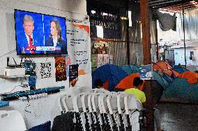 2024 US Presidential Election: Migrants Watch First Debate Harris/Trump In Tijuana, Mexico Shelter