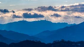 Wind Turbines Spin on A Mountaintop in Chongqing