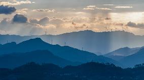 Wind Turbines Spin on A Mountaintop in Chongqing