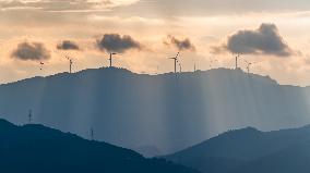 Wind Turbines Spin on A Mountaintop in Chongqing