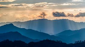 Wind Turbines Spin on A Mountaintop in Chongqing