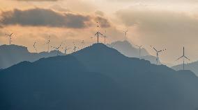 Wind Turbines Spin on A Mountaintop in Chongqing