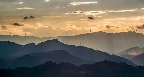 Wind Turbines Spin on A Mountaintop in Chongqing