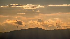 Wind Turbines Spin on A Mountaintop in Chongqing