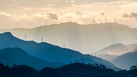 Wind Turbines Spin on A Mountaintop in Chongqing