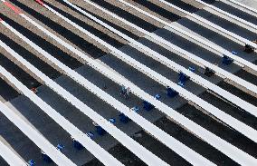 Workers Checking Wind Turbine Blades - Xinjiang