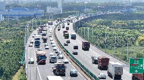 Vehicles Travel on the Shanghai-Suzhou-Nantong Yangtze River Bridge in Suzhou