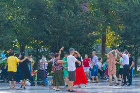 Senior Citizens Dance in A Square in Chongqing