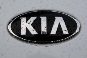 Car Logos In The Rain In Krakow