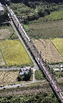 Bullet train cars disengage en route to Tokyo