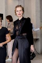 Eva Herzigova leaves her hotel during Milan Fashion Week