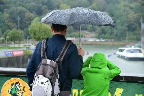 People With Umbrellas In The Lyon Kayak