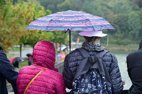 People With Umbrellas In The Lyon Kayak