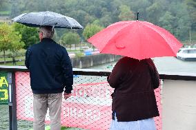 People With Umbrellas In The Lyon Kayak