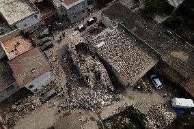 Building Collapse In The Neapolitan Area, People Are Digging Through The Rubble.