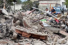 Building Collapse In The Neapolitan Area, People Are Digging Through The Rubble.