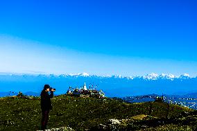 Tourists Are Enjoying The Scenery Of The Mountain Range From Sailung Hill In Dolakha, Nepal