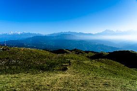 Tourists Are Enjoying The Scenery Of The Mountain Range From Sailung Hill In Dolakha, Nepal