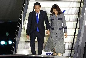 Japan PM returns home