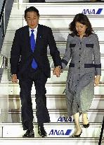 Japan PM returns home