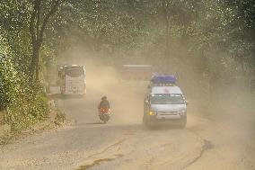 Passengers Suffer From Dust Pollution While Traveling On Prithvi Highway In Dhading.