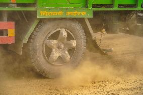 Passengers Suffer From Dust Pollution While Traveling On Prithvi Highway In Dhading.