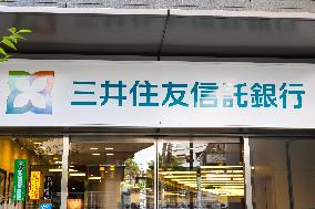 Sumitomo Mitsui Trust Bank signage and logo