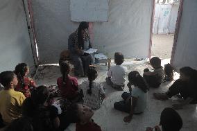 Palestinian students at a tent school