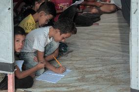 Palestinian students at a tent school