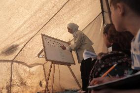 Palestinian students at a tent school