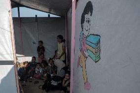 Palestinian students at a tent school