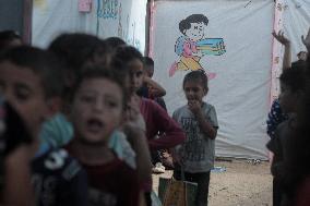 Palestinian students at a tent school