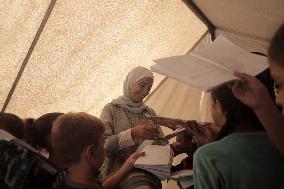 Palestinian students at a tent school