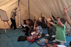 Palestinian students at a tent school