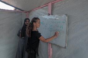 Palestinian students at a tent school