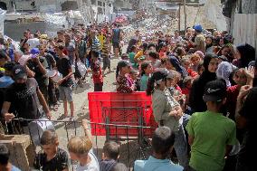 People Get Food Relief In Jabalia Refugee Camp - Gaza