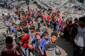 People Get Food Relief In Jabalia Refugee Camp - Gaza