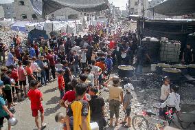 People Get Food Relief In Jabalia Refugee Camp - Gaza