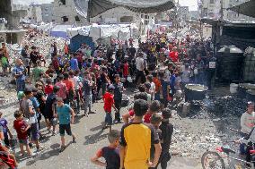 People Get Food Relief In Jabalia Refugee Camp - Gaza